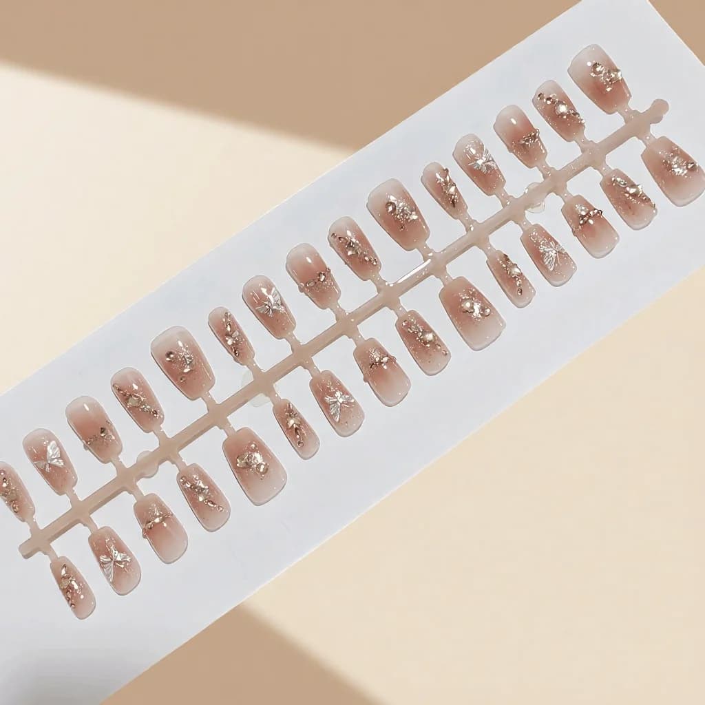 Liblika- ja tähekujuliste rhinestone'idega press-on küüned, glitterviimistlus